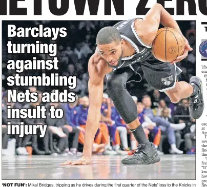  ?? N.Y. Post: Charles Wenzelberg ?? ‘NOT FUN’: Mikal Bridges, tripping as he drives during the first quarter of the Nets’ loss to the Knicks in Brooklyn on Tuesday, didn’t enjoy Barclays Center being taken over by his team’s crosstown rivals. “I feel like any person in here it’s not fun when you feel like you’re in an away game at home,” he said. “So that’s for any person sitting in here, any person alive.”