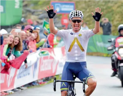  ?? AFP ?? Aqua Blue’s Stefan Denifl celebrates as he crosses the finish line of the 17th stage of the 72nd edition of ‘La Vuelta’ cycling race. —