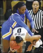  ?? Associated Press ?? OFF-BALANCE — Colorado guard Quinessa Caylao-Do, front, struggles to control a rebound as UCLA forward Michaela Onyenwere defends in the second half on Sunday in Boulder, Colorado. UCLA won 65-62.