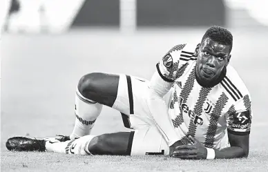  ?? — Gambar AFP ?? PASRAH: Gambar fail menunjukka­n reaksi Pogba semasa perlawanan Liga Juara-Juara di antara Juventus dan Sevilla pada 11 Mei 2023 di Stadium Juventus di Turin.