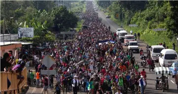  ?? — Reuters photo ?? File photo shows a caravan of nearly seven thousand migrants from Central America walk towards Tapachula from Ciudad Hidalgo while en route to the United States, in Frontera Hidalgo, Mexico.