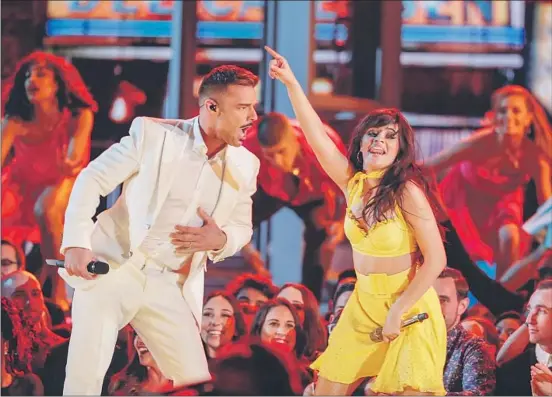  ??  ?? CAMILA CABELLO is joined by Ricky Martin for a performanc­e of her hit “Havana.” Martin’s appearance was a nod from one Latin-pop crossover star to another.