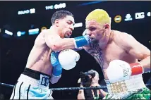  ?? (AP) ?? Danny Garcia (left), punches Ukraine’s Ivan Redkach during the 12th round of a welterweig­ht boxing match on Jan 26 in New York. Garcia won
the fight.