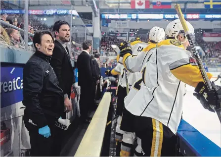  ?? DAVID BEBEE WATERLOO REGION RECORD FILE PHOTO ?? Sarnia Sting athletic therapist Amy Mausser of Kitchener cheers as her team scores against the Rangers earlier this season.