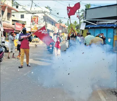  ?? PTI ?? Left Democratic Front supporters celebrate winning trends during the counting of votes for the Kerala assembly poll results in Thiruvanan­thapuram on Sunday.