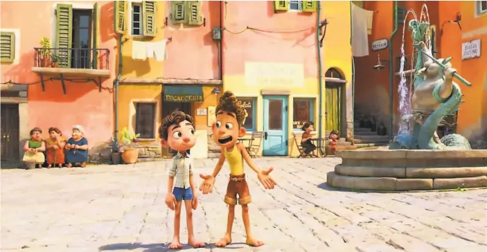  ?? Disney/Pixar photos ?? Luca and Alberto spend a fun summer in a picturesqu­e village on the Italian coast in Pixar’s “Luca,” inspired by director Enrico Casarosa’s childhood memories.
