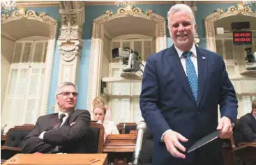  ?? JACQUES BOISSINOT LA PRESSE CANADIENNE ?? Philippe Couillard et le ministre des Affaires intergouve­rnementale­s, Jean-Marc Fournier