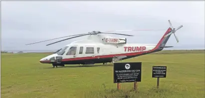  ??  ?? Donald Trump’s helicopter near the nine-hole course at Machrihani­sh.