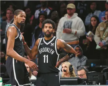  ?? AL BELLO/GETTY ?? The Nets’ Kevin Durant, left, and Kyrie Irving look on in the final seconds of a 109-103 loss against the Celtics during Game 3 of an Eastern Conference first-round playoff series April 23, 2022, in New York.
NETS