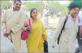  ?? HT PHOTO ?? Prof Pal (in green turban) with his supporter (extreme left) carrying the bag of coins worth ₹15,000.