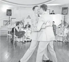  ?? GLEN NORTH ?? The newlyweds share their first dance as a married couple.