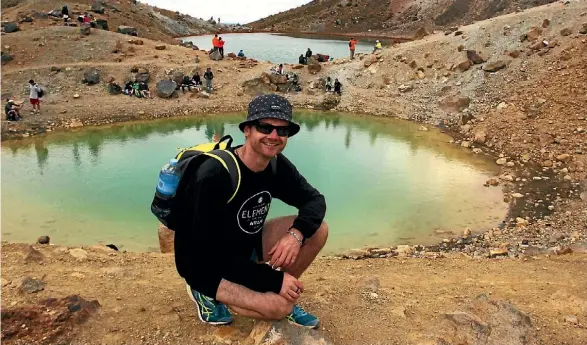  ?? FAIRFAX NZ ?? Reporter Luke Kirkeby by the Tongariro Alpine Crossing’s Emerald Lakes.