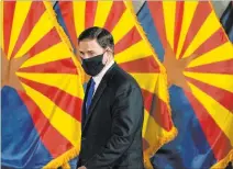  ?? The Associated Press file ?? Arizona Gov. Doug Ducey’s latest executive order allows businesses to enforce mask and distancing requiremen­ts if they want, but cities and counties must lift theirs.