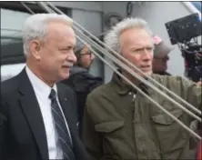  ?? PHOTO BY KEITH BERNSTEIN — WARNER BROS. ?? From left, Tom Hanks with director/producer Clint Eastwood on the set of “Sully.”