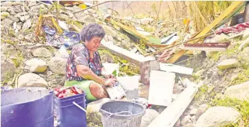  ?? Picture: JOVESA NAISUA ?? Mereia Vuki of Yaro Village washes clothes at a nearby drain.