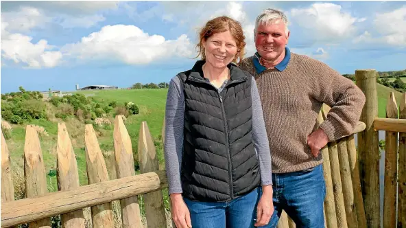  ?? CATHERINE GROENESTEI­N/STUFF ?? Jane and Damian Roper on a balcony of their new pa¯ , which overlooks their South Taranaki farm.