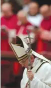  ?? THE ASSOCIATED PRESS ?? Pope Francis bows at the altar as he celebrates the Christmas Eve Mass on Saturday in St. Peter’s Basilica at the Vatican.