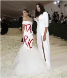  ?? John Angelillo/UPI/Rex/Shuttersto­ck ?? Alexandria Ocasio-Cortez arrives with Aurora James on the red carpet for the Met Gala at the Metropolit­an Museum of Art on Monday in New York, New York. Photograph: