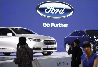  ??  ?? FORD TAURUS cars are seen during a presentati­on at the 16th Shanghai Internatio­nal Automobile Industry Exhibition in Shanghai, April 21, 2015.