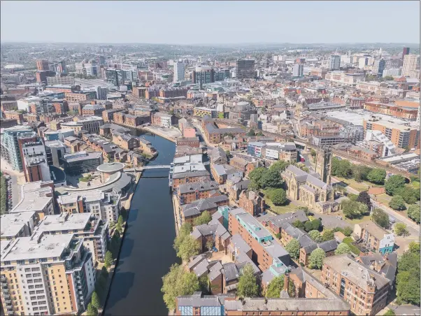  ??  ?? MODERN TIMES: The changing face of Leeds city centre with Leeds Minster right and River Aire, demonstrat­es the huge appetite for change in the North.