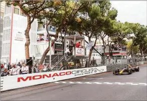  ?? Peter Fox / Getty Images ?? Sergio Perez of Red Bull Racing takes the chequered flag during the F1 Grand Prix of Monaco at Circuit de Monaco on Sunday in Monte-Carlo, Monaco.