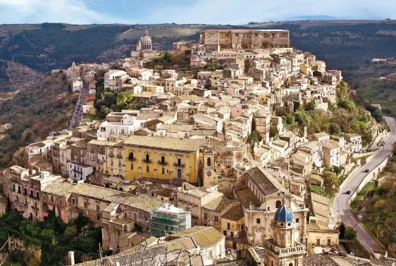  ??  ?? SICILIAN SPLENDOUR: Rebuilt after a devastatin­g earthquake in 1693, the old town of Ragusa Ibla features in the Inspector Montalbano series