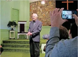  ?? [PHOTO BY BECCA MILFELD, FOR THE WASHINGTON POST] ?? President Jimmy Carter greets the congregati­on ahead of his Sunday school lesson at Maranatha Baptist Church in Plains, Georgia.