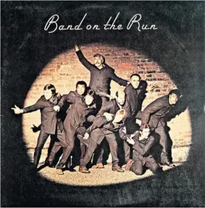  ??  ?? In the spotlight: the star-studded album cover for Band on the Run,