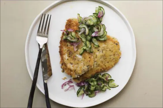  ?? SARAH E CROWDER VIA AP ?? Schnitzels are often made with veal or chicken, but pork is a great alternativ­e. Pounding out the cutlets makes them even tenderer and thinner, so they cook up quickly, perfect for a weeknight meal.