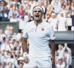  ?? Clive Brunskill / Getty Images ?? Roger Federer celebrates victory in his semifinal match against Rafael Nadal at Wimbledon in 2019.