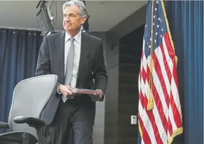  ?? Alex Wong, Getty Images ?? Jerome Powell, the new chairman of the Federal Reserve, on Wednesday arrives for his first news conference in Washington, D.C. Earlier in the day, the Federal Reserve raised its key interest rate to 1.75 percent.