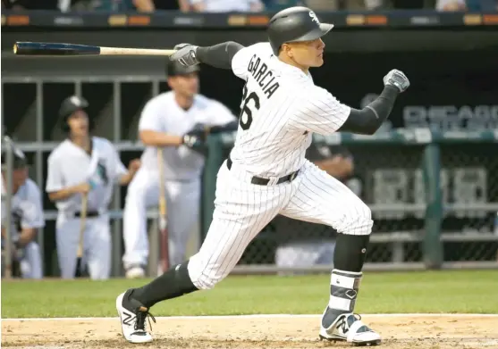  ?? | CHARLES REX ARBOGAST/ AP ?? White Sox right fielder Avisail Garcia, who went 2- for- 5, hits an RBI double off Orioles starting pitcherWad­e Miley in the third inning Monday night.
