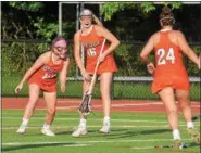  ?? AUSTIN HERTZOG - DIGITAL FIRST MEDIA ?? Perkiomen Valley’s Kate Hickey, left, Caitlin Leap (24) and Riley McGettigan (16) celebrate after McGettigan scored what they believed was a buzzer-beater to send the game to overtime.