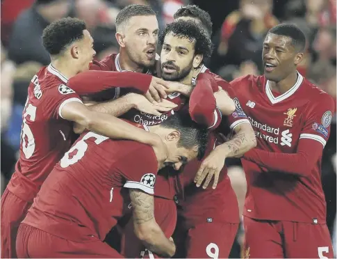  ??  ?? 0 Liverpool’s Mo Salah celebrates the first of his two goals in the Champions League semi-final first leg win against Roma.