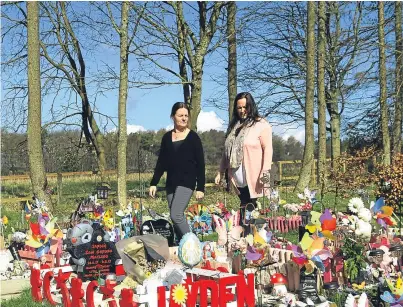 ?? Picture: Dougie Nicolson. ?? Clare and Aileen at the baby area in Birkhill Cemetery which is littered with toys and balloons.