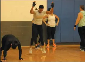  ?? MICHILEA PATTERSON — FOR MEDIANEWS GROUP ?? Women do exercise movements during a fitness boot camp held at the Olivet Boys &amp; Girls Club Ricketts Center in Pottstown. The community club offers an afterschoo­l program for youth but also a community fitness opportunit­y for adults.