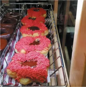  ?? HANDOUT PHOTO BY @CRACKMACS ?? Poppy doughnuts are displayed at a Tim Hortons restaurant in Calgary in this undated handout photo.