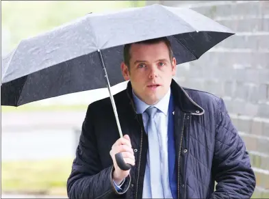  ?? ?? CALM BEFORE THE STORM:
Douglas Ross arriving for the Moray Council election count on Thursday