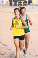  ?? GLEN ROSALES/JOURNAL NORTH ?? Pojoaque Valley’s Mia Vigil, who is trying cross-country after years as a track distance runner, chases Pecos runner Savannah Ortiz.