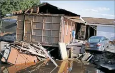  ?? David Goldman/Associated Press ?? Part of the Starlite Motel is washed away in the aftermath of Hurricane Florence on Wednesday in Spring Lake, N.C.