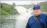  ?? TROY TURNER/THE WESTERN STAR ?? Nicholas Mercer, still recovering from his ferry ride, standing on the wharf in front of Grand Bruit’s majestic waterfall.