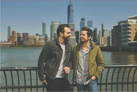  ?? CHRISTOPHE­R GREGORY/THE WASHINGTON POST ?? Broadway actors Max Clayton, left, and Matt Doyle have spent most nights binge-watching TV in their Jersey City apartment since COVID-19 shut down their respective shows. Both had contracted the novel coronaviru­s and have since recovered.