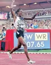  ?? CLEMENT MAHOUDEAU AFP ?? FAITH Kipyegon celebrates after breaking the world record in the mile event at the Diamond League meeting in Monaco on Friday night. |