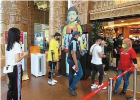  ?? ?? Popular choice: A file picture of shoppers at Sunway Pyramid undergoing temperatur­e checks. Sunway-reit continuest­obeatop pick in the segmentwit­hits well-diversifie­d income base, encompassi­ng retail malls, offices, hotels and hospitals.