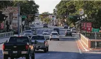  ?? Kin Man Hui / Staff file photo ?? Traffic moves down Main Street in Boerne in 2017. To relieve congestion, officials are looking to divert traffic away from main roads that cut through downtown.