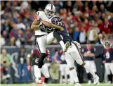  ?? PHOTO: USA TODAY ?? Oakland Raiders tight end Mychal Rivera is tackled by Houston Texans defensive back Eddie Pleasant during an AFC wildcard game.