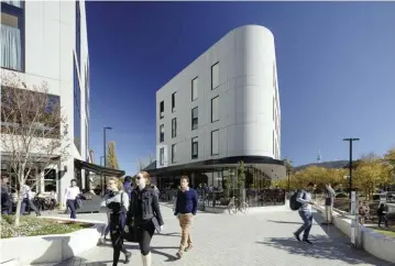  ??  ?? The curved shape of the Health and Wellbeing Centre mirrors the bend in Sullivans Creek beyond it. Photograph: John Gollings