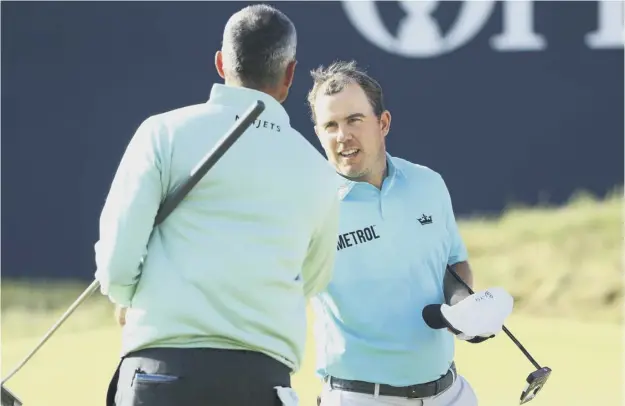  ?? PICTURE: GETTY IMAGES ?? 0 Richie Ramsay shakes hands with Matt Kuchar after the pair fed off each other to make promising starts in the 146th Open Championsh­ip.