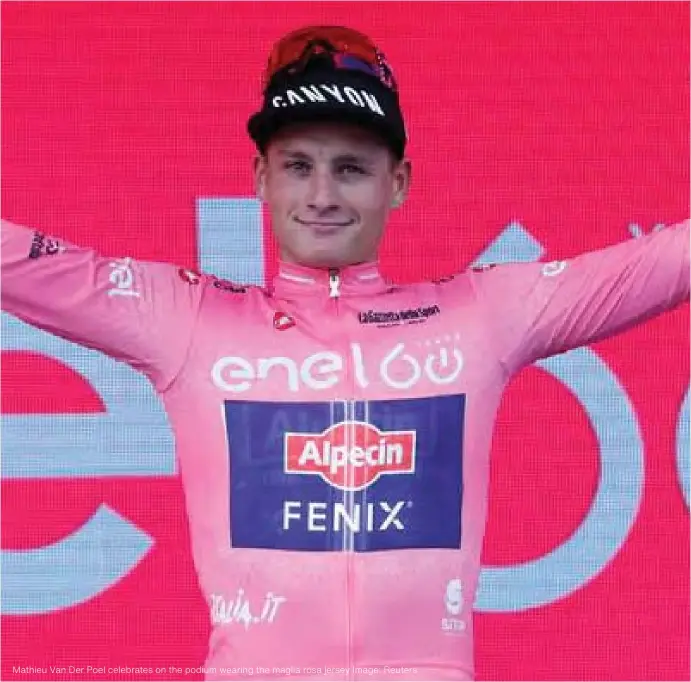  ?? ?? Mathieu Van Der Poel celebrates on the podium wearing the maglia rosa jersey Image: Reuters