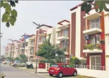  ??  ?? ■
The facade of the houses are identical in nature and painted in shades of beige and red. There are three daily needs stores, which ensure that residents don’t need to step out for their groceries.